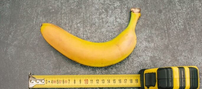 Penis measurement using a banana as an example.